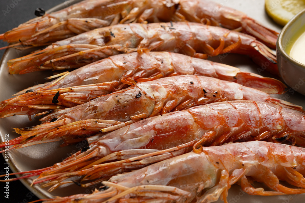 Fried shrimps on plate with fresh vegetables and lemon slice. Seafood background. Fried shrimps on plate with fresh vegetables and lemon slice. Seafood background.
