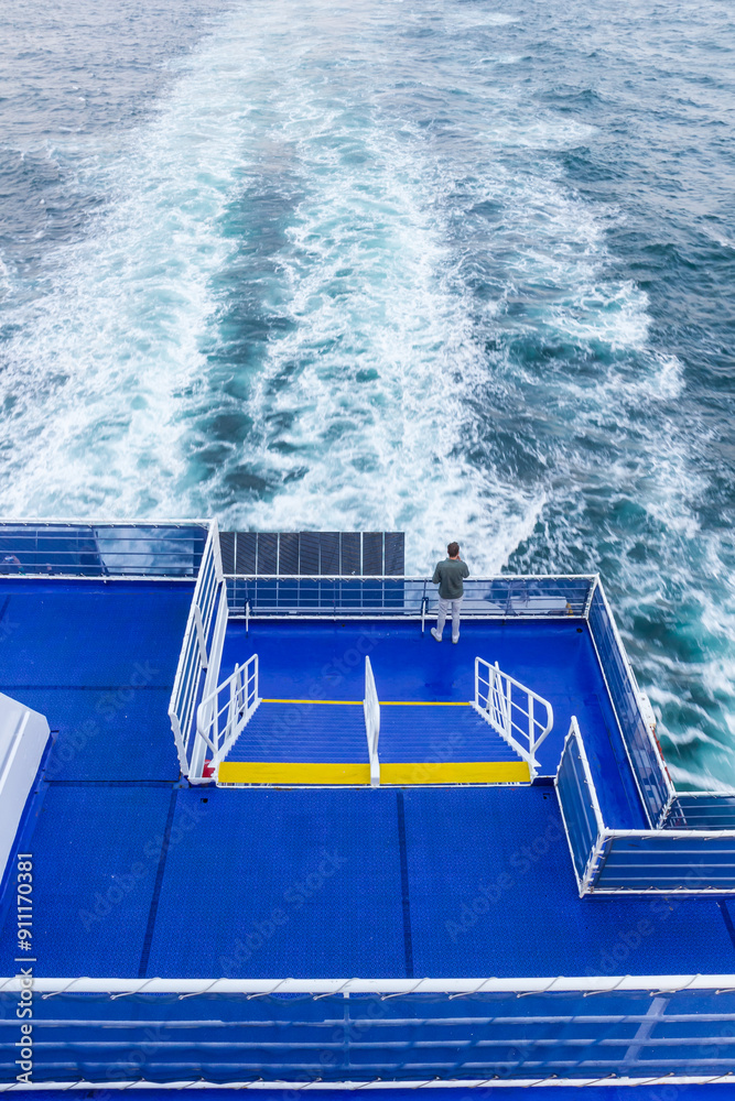 Man looking out over the North Sea on a ferry between Holland and England