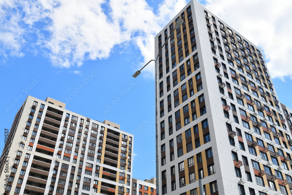 Obraz premium Modern new residential building with air conditioner baskets on facades, Russia
