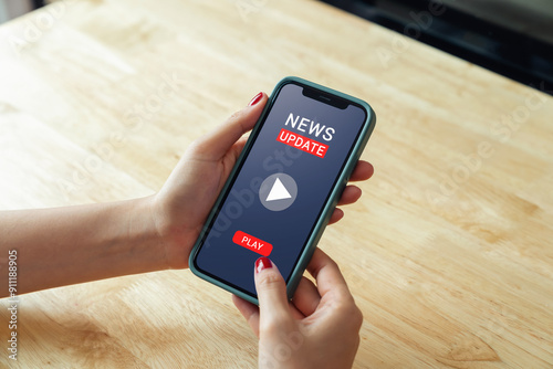 woman hand using smartphone with watch news videos online.