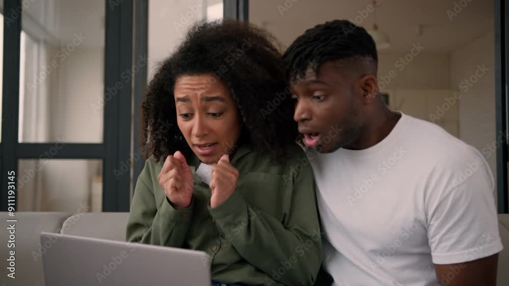 African American couple woman man female male girlfriend boyfriend hope wish expect result looking at laptop computer screen receive email bad news upset sad disappointed problem fail credit at home