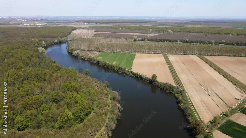 Aerial view of green woods and agricultural fields on riversides Aerial view of green woods and agricultural fields on riversides