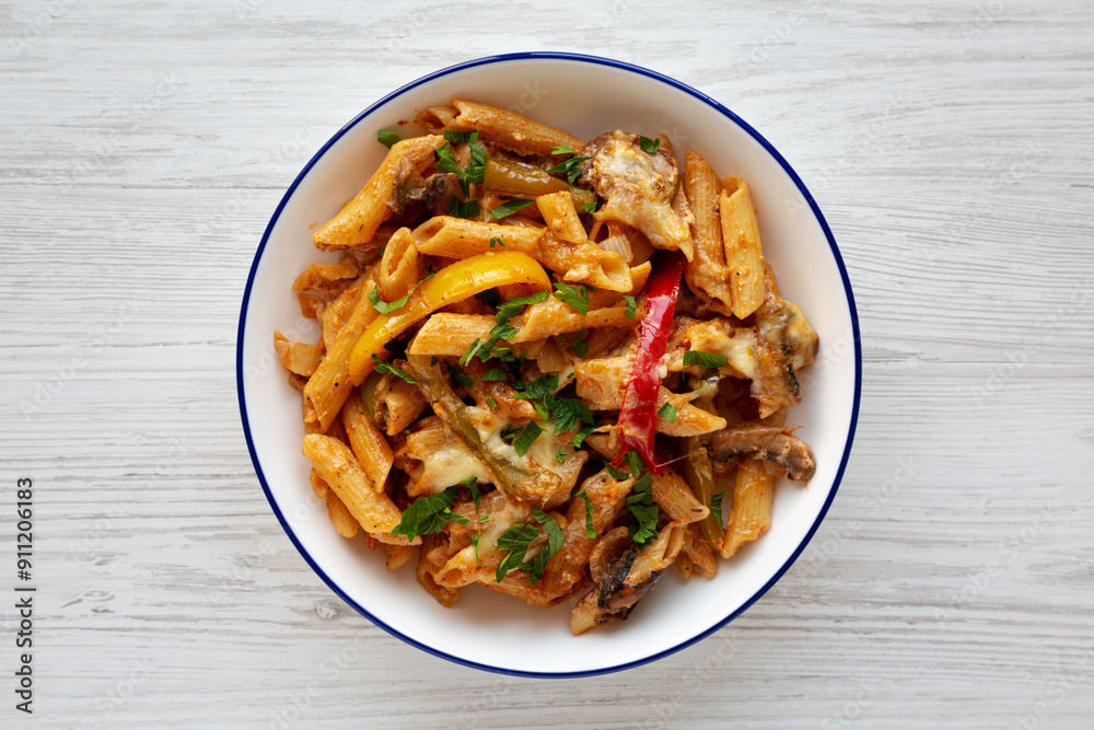 Homemade Fajita Pasta Bake on a Plate, top view. Flat lay, overhead, from above. Homemade Fajita Pasta Bake on a Plate, top view. Flat lay, overhead, from above.