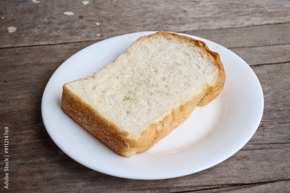 Breakfast of sliced bread on wood background Breakfast of sliced bread on wood background