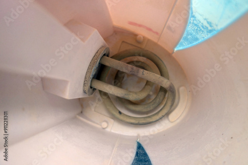 The interior of an electric kettle with a stone on the radiator. photo