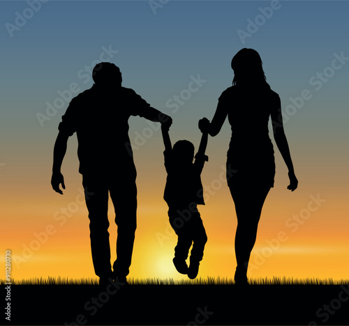 Couple swinging their son on grass field outdoor with sunset background silhouettes.