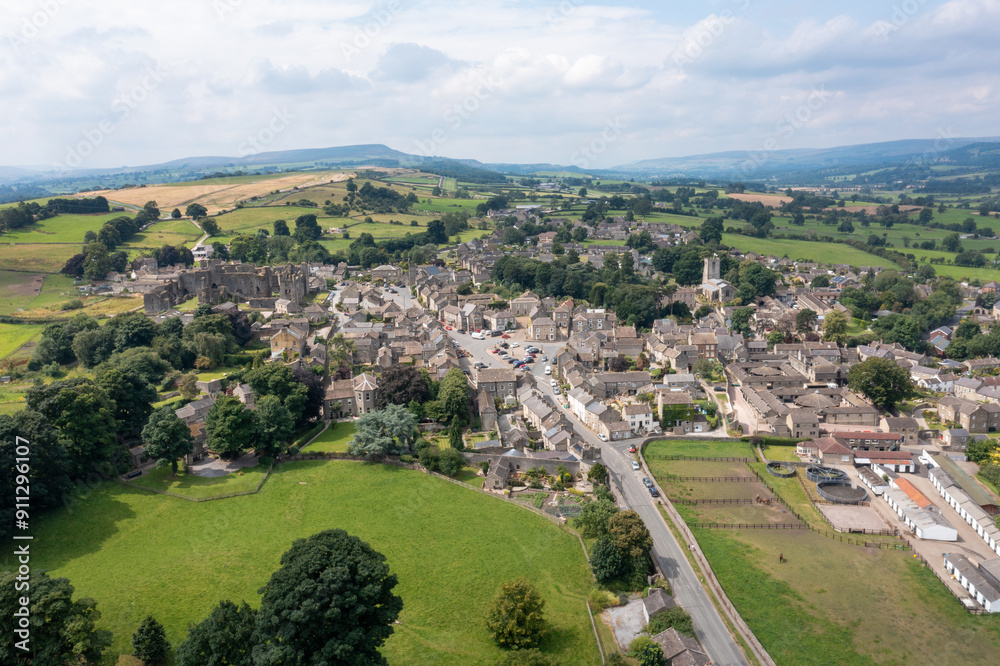 Aerial drone photo of the beautiful town of Middleham in Leyburn in North Yorkshire in the UK showing the British countryside town and the historic Middleham Castle on a sunny day in the summer time Aerial drone photo of the beautiful town of Middleham in Leyburn in North Yorkshire in the UK showing the British countryside town and the historic Middleham Castle on a sunny day in the summer time