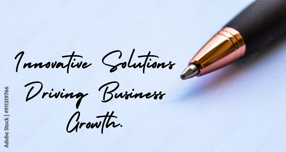 Fototapeta premium Innovative solutions driving business growth text with close up pen background. Business strategy and growth concept.