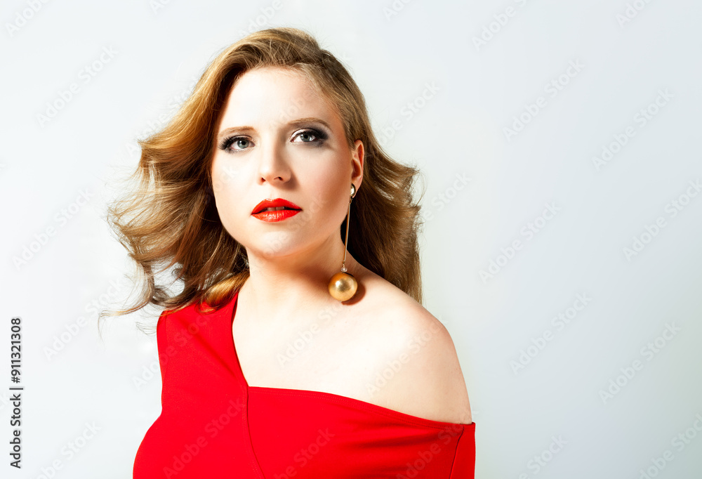Beautiful fashionable young blonde woman in a studio. Beautiful fashionable young blonde woman in a studio.