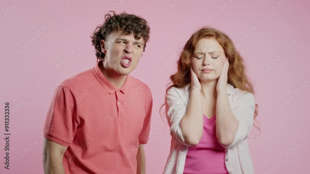 Angry Man quarrels Wife Or Girlfriend On pink. Couple Relationships, Quarrel Angry Man quarrels Wife Or Girlfriend On pink. Couple Relationships, Quarrel