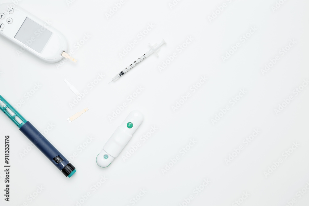 Diabetes concept with glucometer, syringe pen with insulin, blood test strips. Concept of worldwide diabetes awareness. Top view. Copy space Diabetes concept with glucometer, syringe pen with insulin, blood test strips. Concept of worldwide diabetes awareness. Top view. Copy space