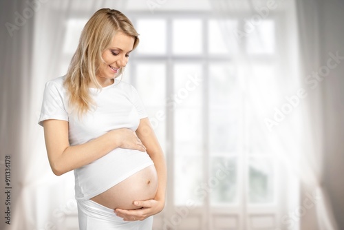 Happy young pregnant woman holds belly Free Download Happy young pregnant woman holds belly - GFXLoad