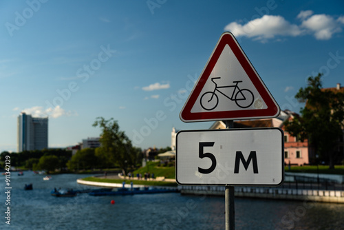 Triangular sign forbidding cyclists, after 5m photo