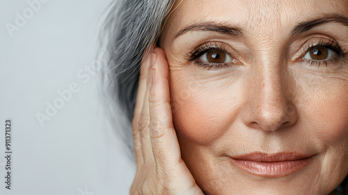 A close up photo of a woman face, age plus 50 for a beauty commercial with wrinkles and skin texture 

 photo