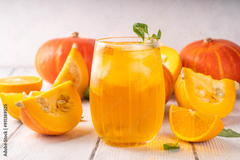Pumpkin and orange autumn lemonade drink. Sweet tasty drink for fall Thanksgiving party, tasty fruit punch or margarita cocktail Pumpkin and orange autumn lemonade drink. Sweet tasty drink for fall Thanksgiving party, tasty fruit punch or margarita cocktail