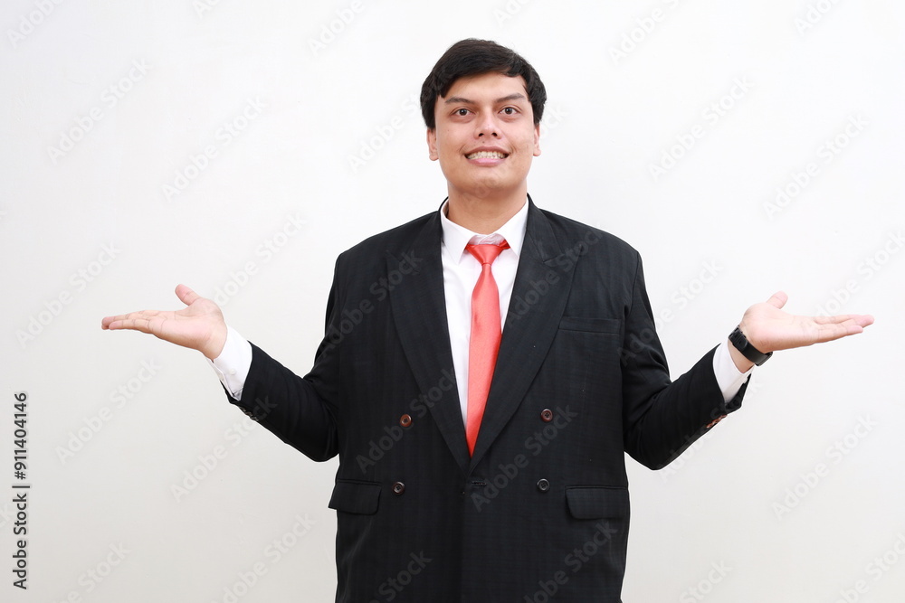 Happy young asian businessman with empty hands gesture isolated over white background. Advertisement and promotion gesture Happy young asian businessman with empty hands gesture isolated over white background. Advertisement and promotion gesture
