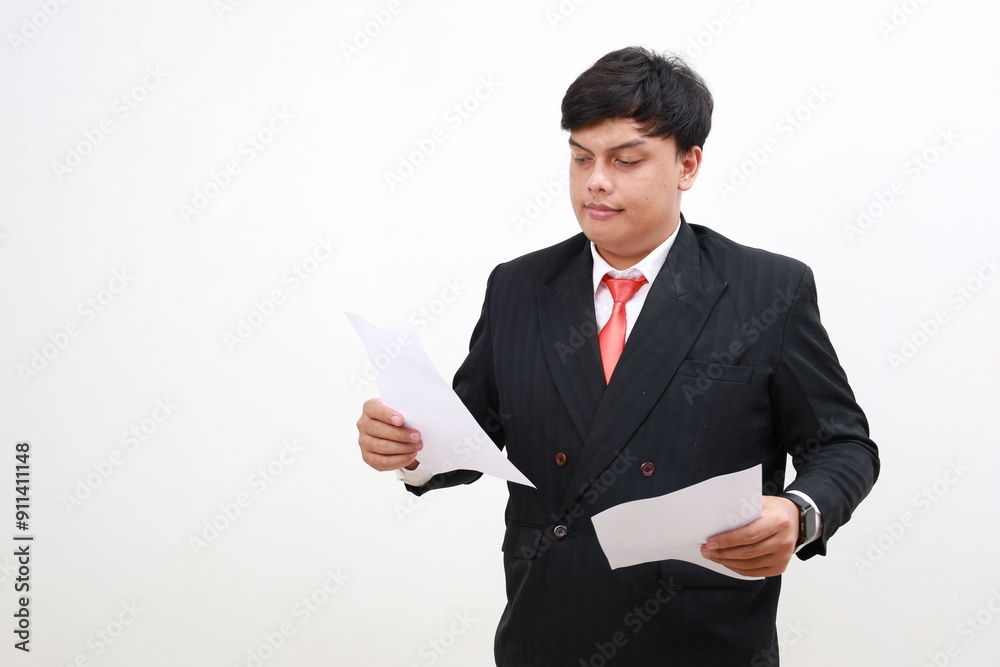 Young asian employee businessman standing holding paper account documents. Isolated on white Young asian employee businessman standing holding paper account documents. Isolated on white