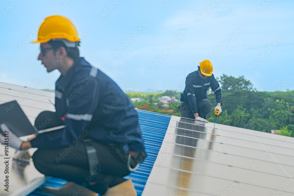 Worker Technicians are working to construct solar panels system on roof. Installing solar photovoltaic panel system. Men technicians walking on roof structure to check photovoltaic solar modules. Worker Technicians are working to construct solar panels system on roof. Installing solar photovoltaic panel system. Men technicians walking on roof structure to check photovoltaic solar modules.