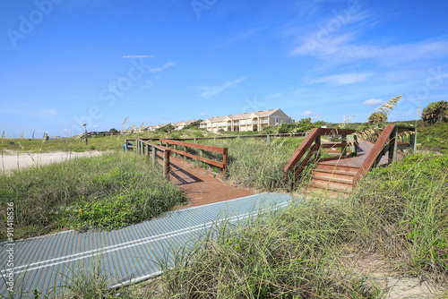 Handicap sand mat on one of the many sand dune walks on Amelia Island, Florida, USA.  photo