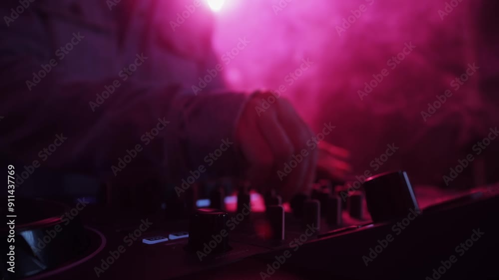 DJ playing music on festival in night club. Techno musician with headphones and sunglasses performing at nightclub for concert crowd of people, city bar. DJ playing music on festival in night club. Techno musician with headphones and sunglasses performing at nightclub for concert crowd of people, city bar.
