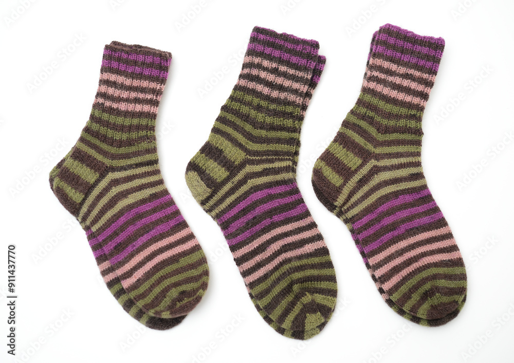 a pair of hand-knitted wool socks featuring a vibrant striped pattern a pair of hand-knitted wool socks featuring a vibrant striped pattern
