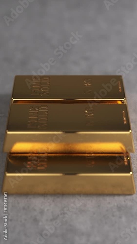 Gyratory vertical view of five bullions. A stack of gold bars on a white concrete background. Gold reserves or gold standard concept. Seamless looping. Phone wallpaper photo