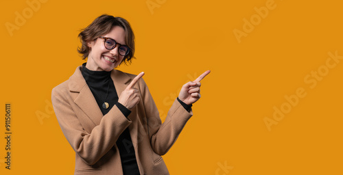 Recommending smiling BusinessWoman pointing at side copy space or advertising. photo