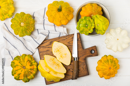 Pattypan zucchini on a textured kitchen table. squash. Fresh organic pattypan squashes on background. Vegan. Farmer's Market. Patisson. Space for text. Copy space. photo