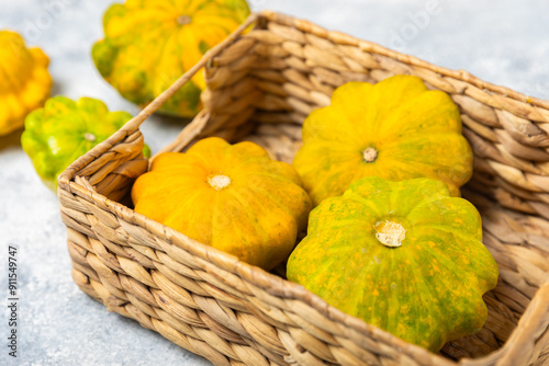 Pattypan zucchini on a textured kitchen table. squash. Fresh organic pattypan squashes on background. Vegan. Farmer's Market. Patisson. Space for text. Copy space. photo