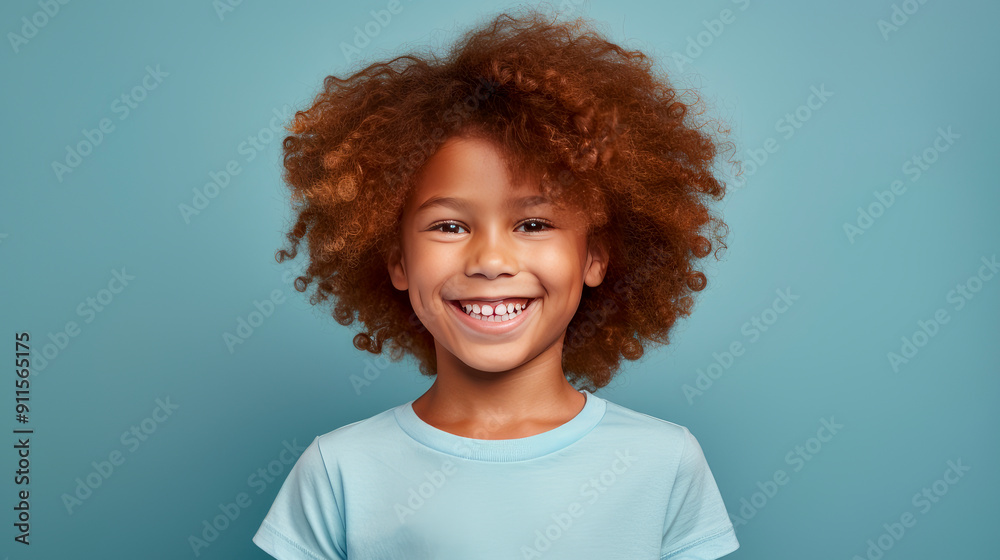 Portrait of a happy smiling Afro-American red-haired boy child with long hair and perfect skin, light blue background, banner. Portrait of a happy smiling Afro-American red-haired boy child with long hair and perfect skin, light blue background, banner.