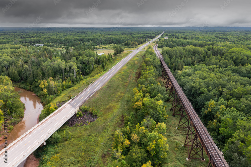 Highway and Train Trestle Recede Into Distance