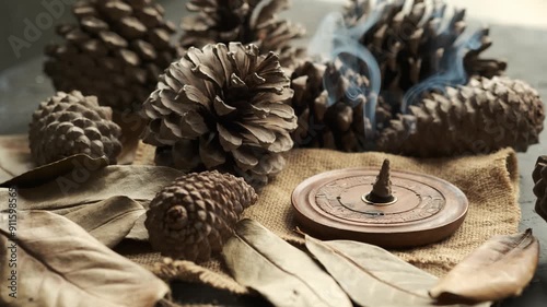 Creating a Peaceful Atmosphere With Pine cones and Incense in a Rustic Setting