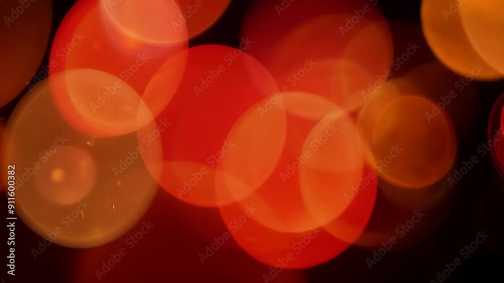 Bright red and gold bokeh lights flickering and rotating in a continuous loop.