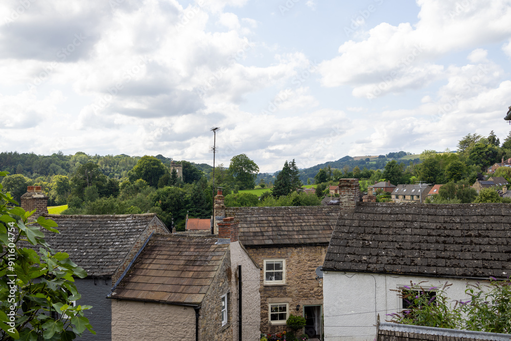 Photo of the beautiful town of Richmond which is a market town and civil parish in North Yorkshire, England showing the historic old houses in the summer time