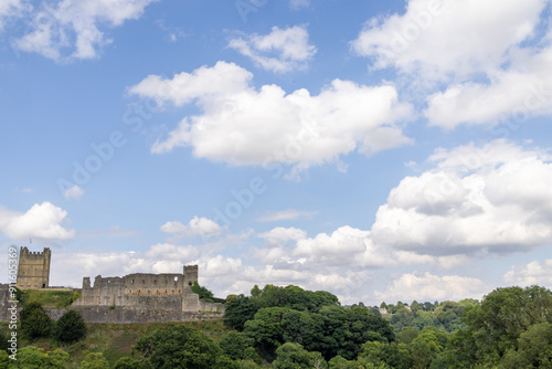 Photo of the beautiful town of Richmond which is a market town and civil parish in North Yorkshire, England showing the historic Richmond Castle on a sunny day in the summer time photo