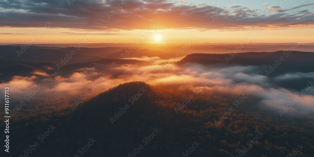A stunning vista from a mountain summit at sunrise, revealing the splendor of pristine nature in all its glory. A stunning vista from a mountain summit at sunrise, revealing the splendor of pristine nature in all its glory.