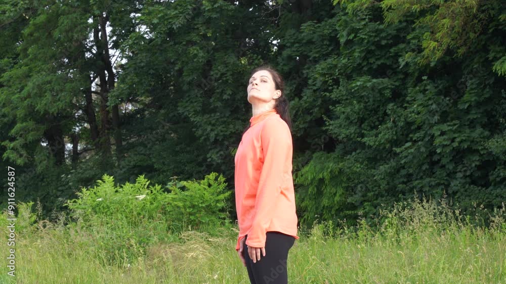 Woman makes exersices in the morning before jogging Woman makes exersices in the morning before jogging