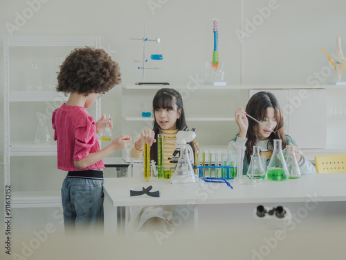 Portrait child kid girl asian young student tree people team group learning and smile have fun happy with science lab technology with in the classroom has a tubetest Microscope chemicals on table photo