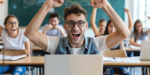 elated student using laptop, classroom background, copy space