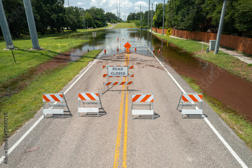 Flood or flooding. Florida flooding after hurricane or tropical storm. Flooded streets, road or highway. Hurricane season. Road closed. Destroyed after rain. City underwater. United States of America photo