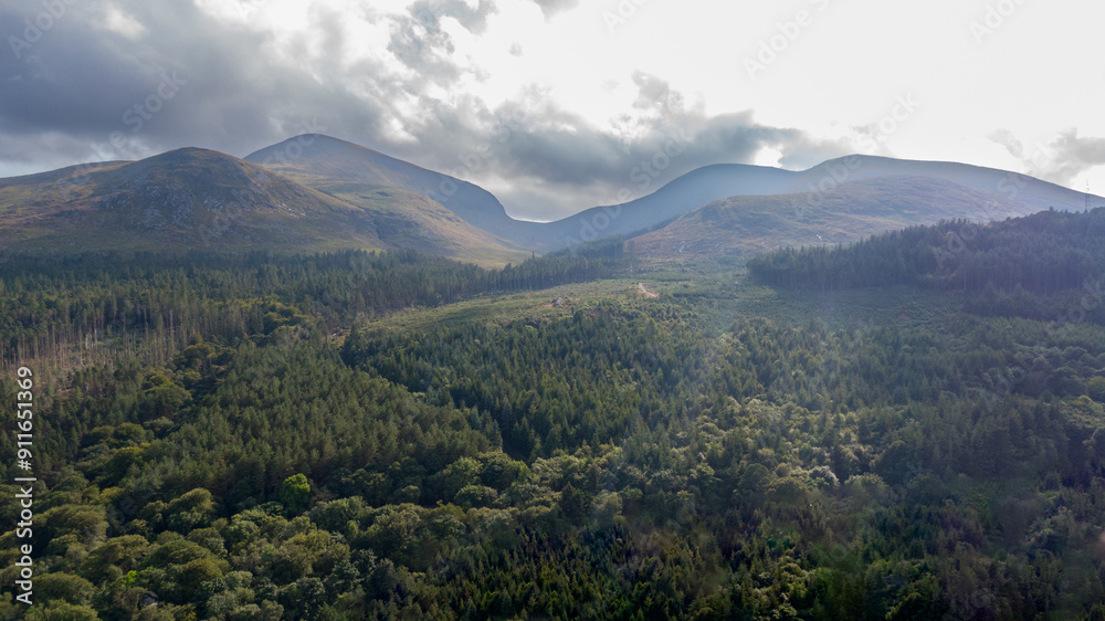 Aerial view on forest and mountains in Newcastle, Northern Ireland. Drone photo of mountain landscape Aerial view on forest and mountains in Newcastle, Northern Ireland. Drone photo of mountain landscape