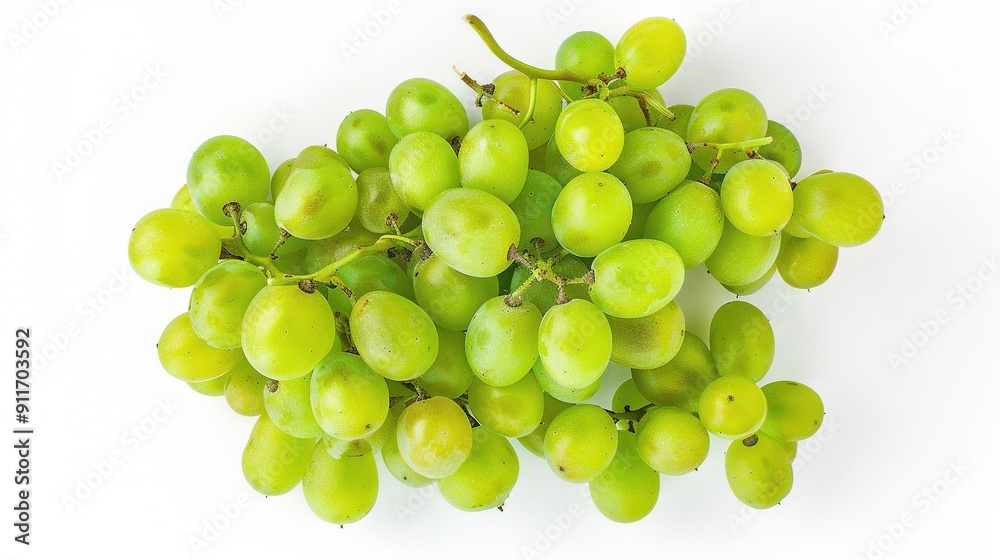 A group of green grapes rests together on a white plate against a white background A group of green grapes rests together on a white plate against a white background