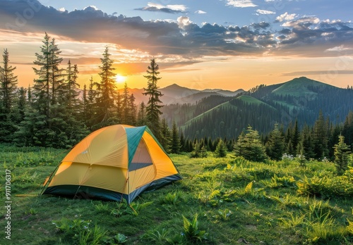 Camping background with a mountain scenery during sunset. There is a yellow tent on the green hills of the mountains surrounded by trees. Outdoors and hiking concept.