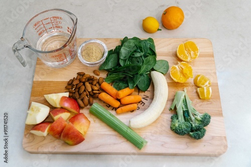 FRUIT and vegetables on a wooden board photo