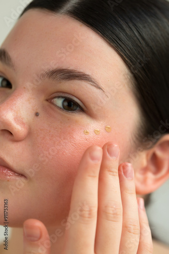Applying makeup primer photo
