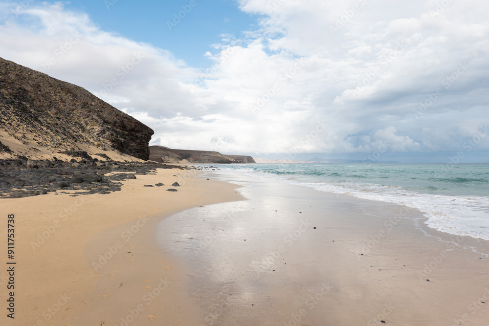 enjoying on a white sand beach in fuerteventura enjoying on a white sand beach in fuerteventura