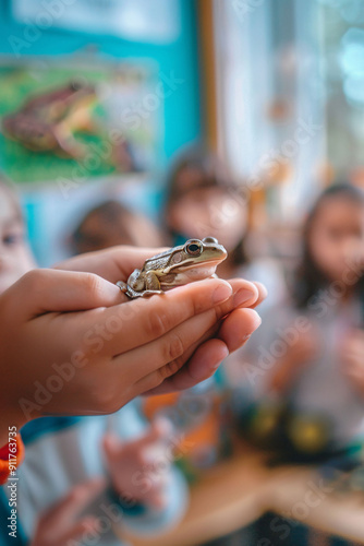 Child Holding a Frog During Class photo