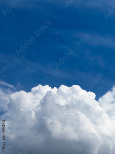 Fluffy white cloud and blue sky photo