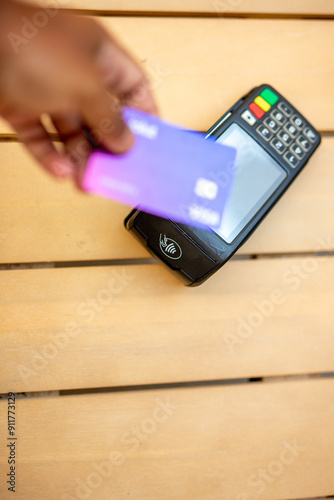 Effortless Checkout. Man Paying with a Credit Card