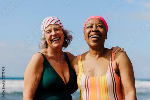 Senior women sharing laughter and joy at the beach